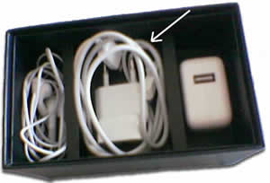 iPhone Stereo headset, Dock Connector to USB cable, and USB power adapter in the iPhone 3G box.